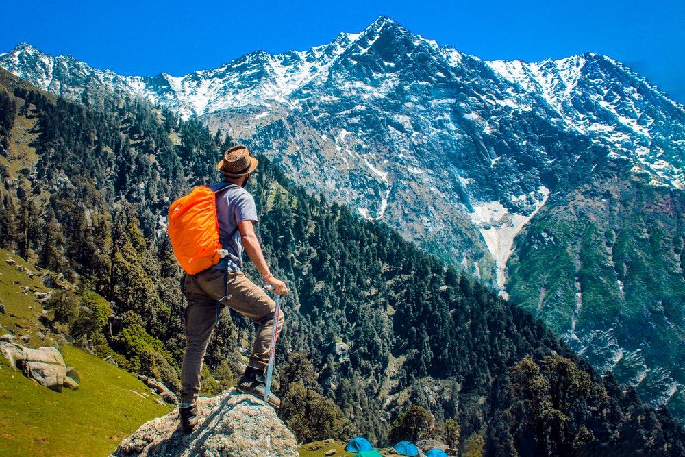 Man On Top Of A Mountain