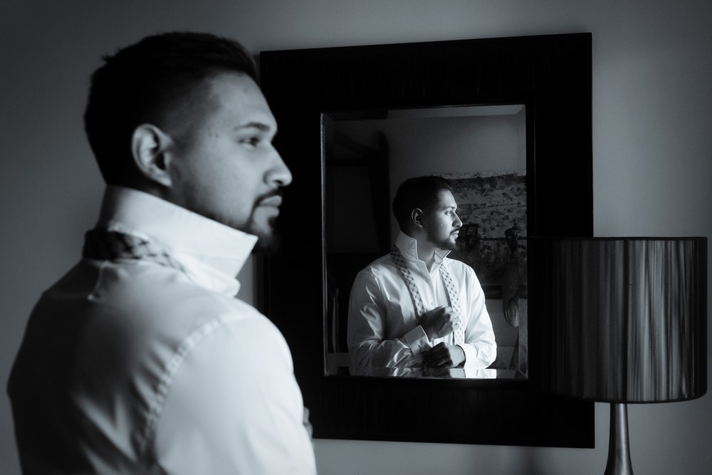 Man In Front Of Mirror