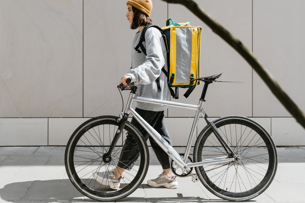 Woman With A Bike Walking