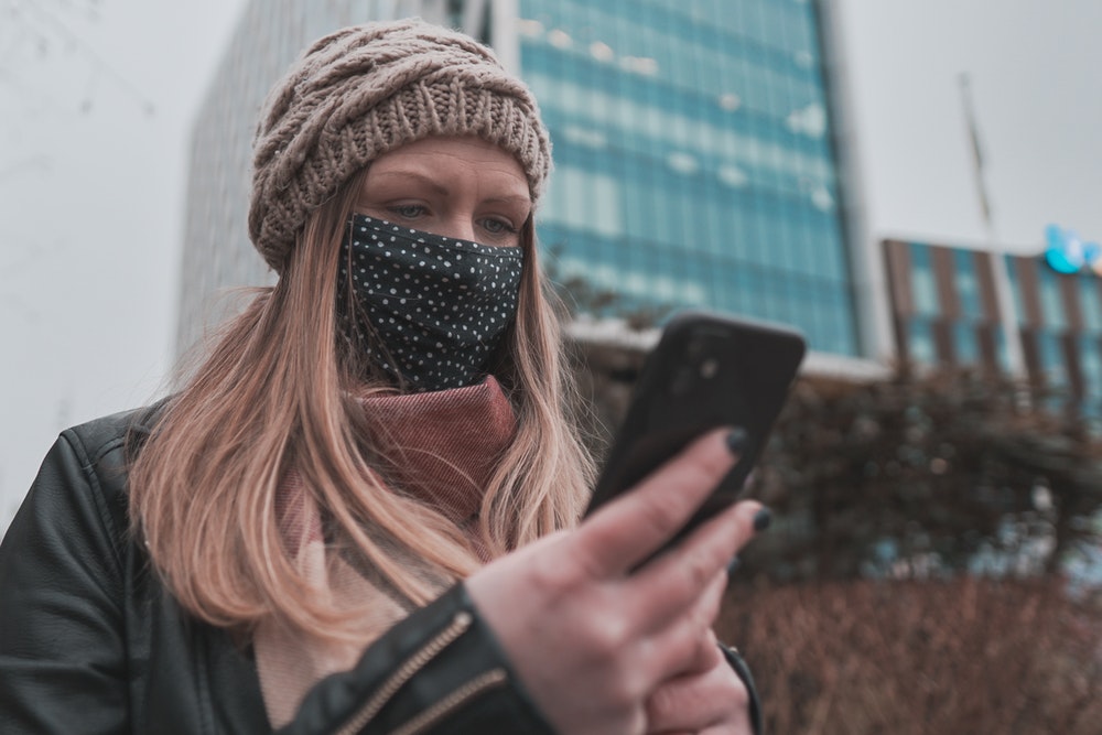 Woman With Mask Texting
