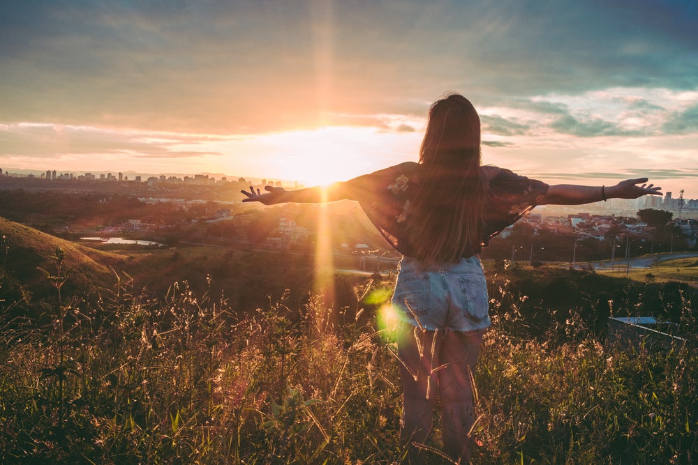 Woman Facing The Sun